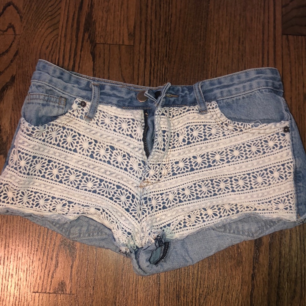 Cut off jean shorts with white lace overlay